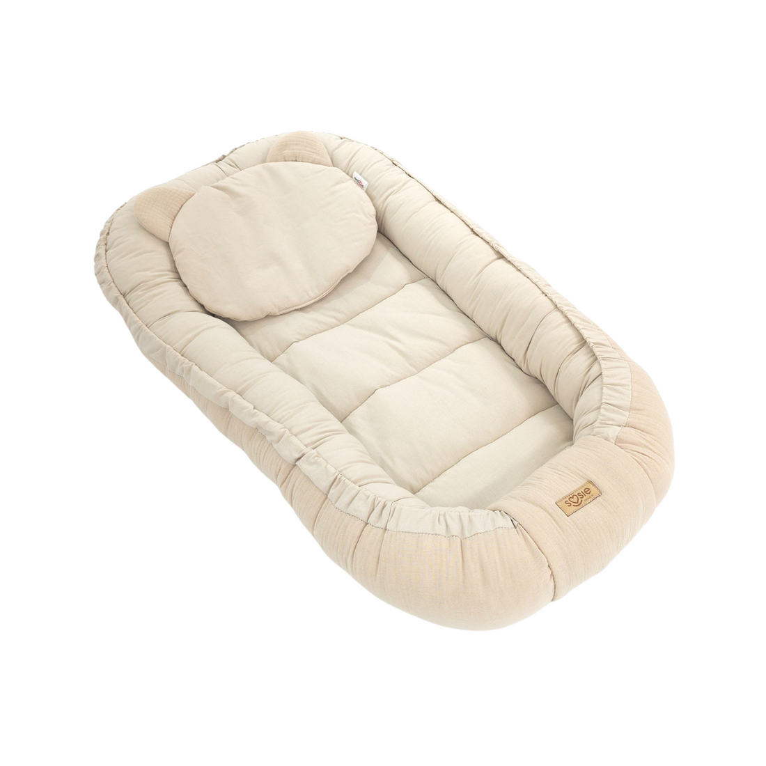 Dubbelzijdig babynestje van katoen en mousseline in beige, met bijpassend kussentje