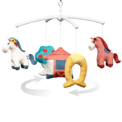 Muziekmobiel Paarden van Babyono, bevestiging aan het bedje